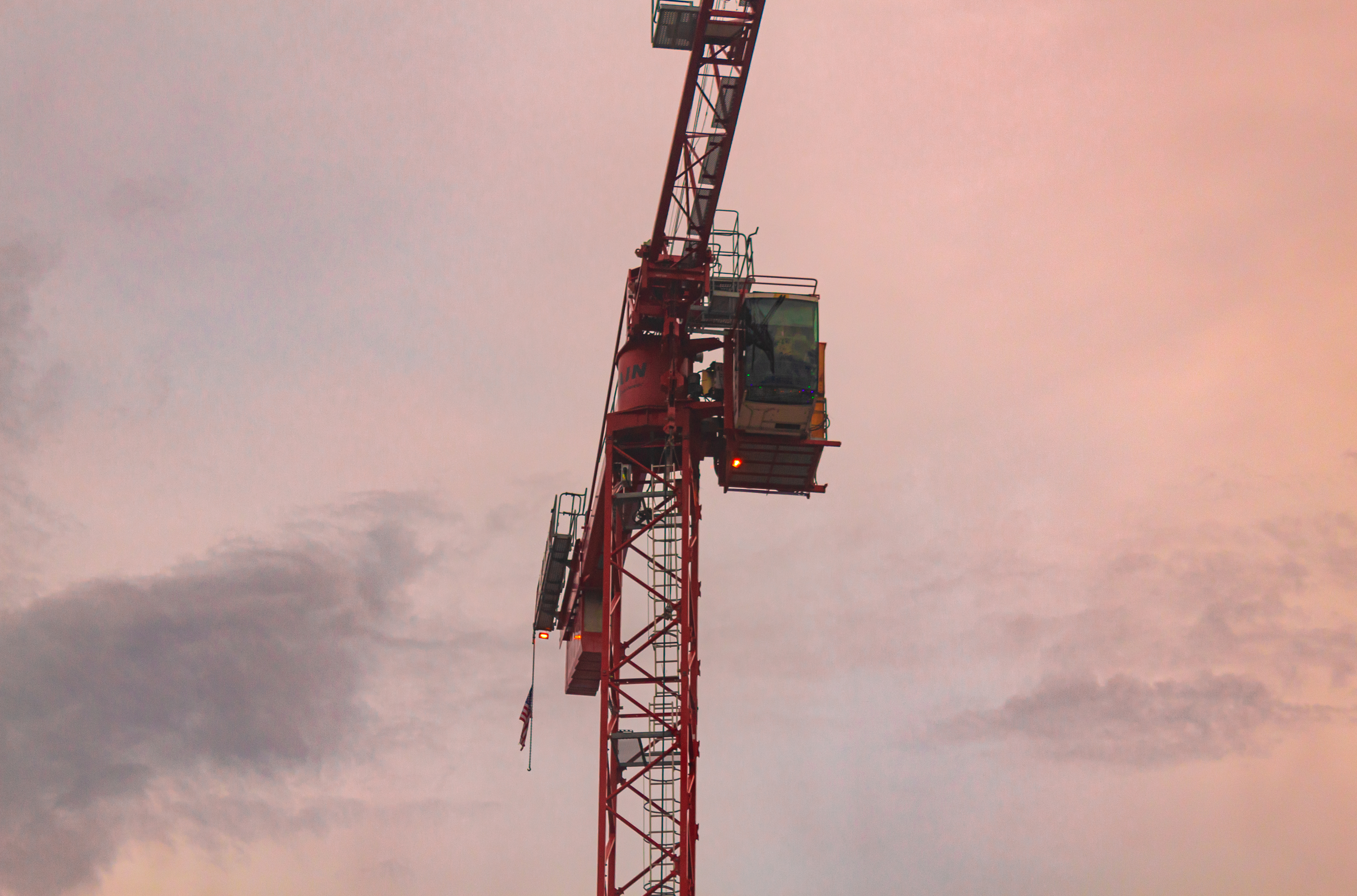 construction crane at sunset after a storm.